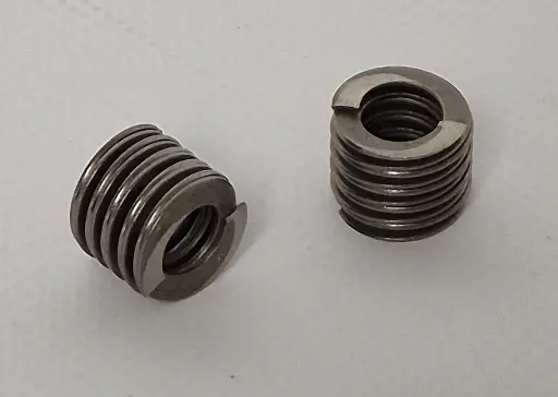 Helical disc spring